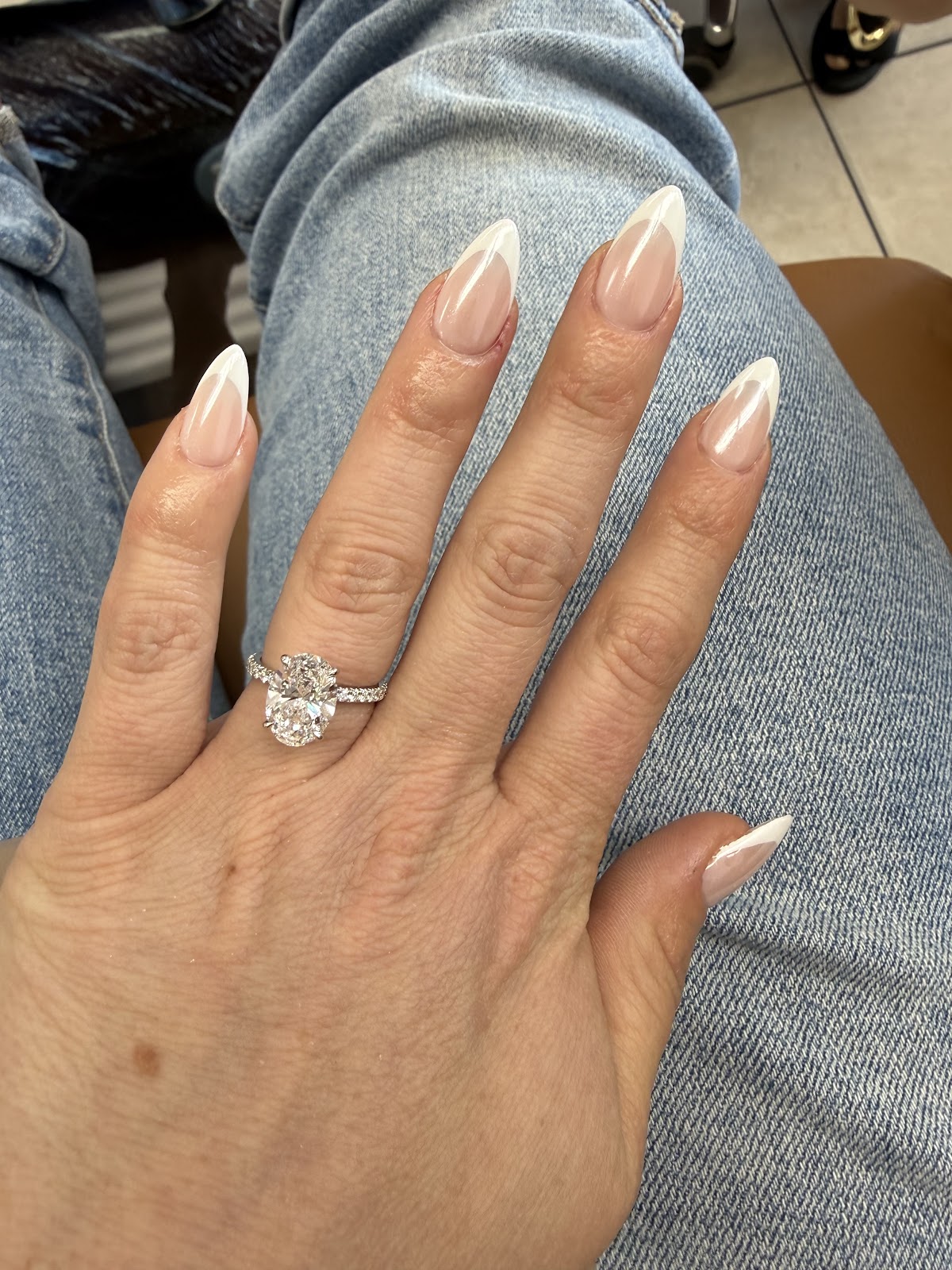 A clean nude almond French manicure photographed in the salon